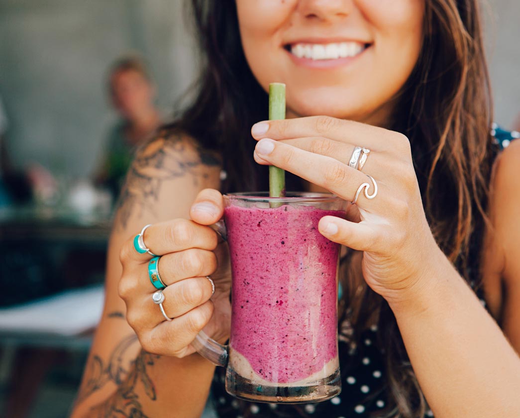 Woman holding a smoothie